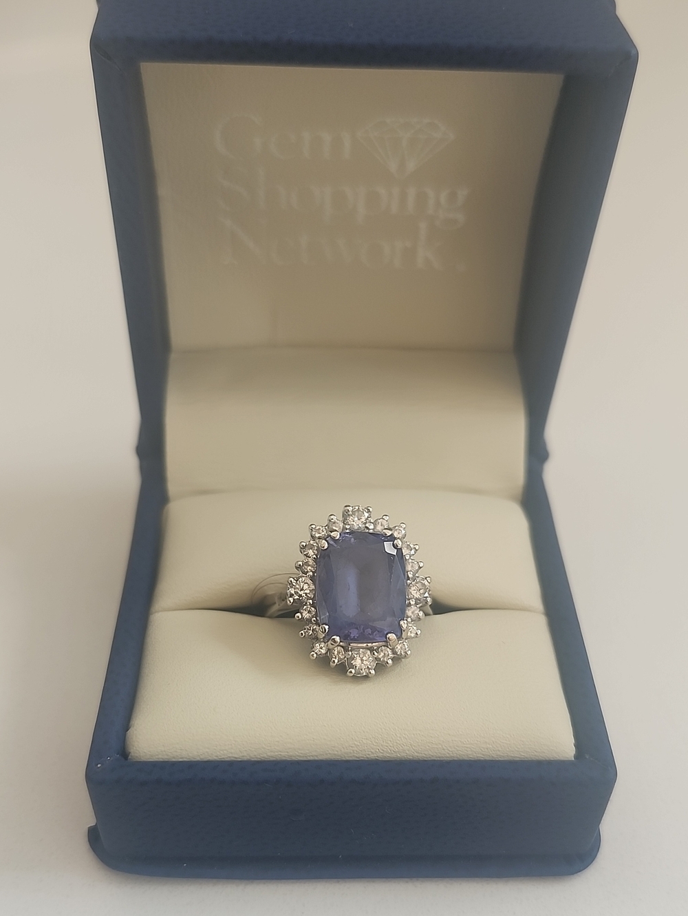 Tanzanite And Diamond Halo Ring